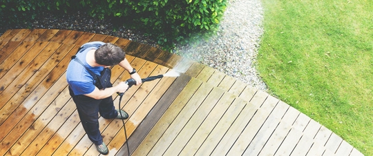man cleaning his deck