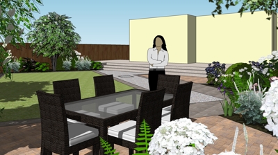 A patio with a dining table and chairs, surrounded by landscaping, and a light yellow building in the background. Photo