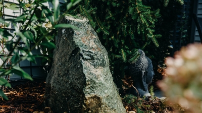 Water feature rock garden with Buddha. Photo